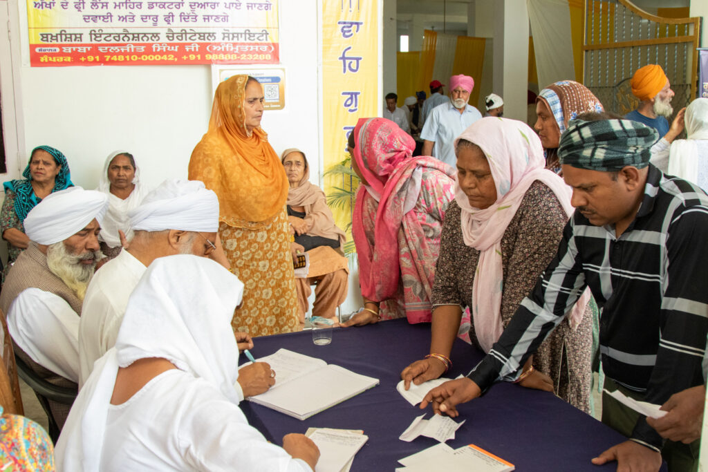 2026-free-medical-camp-bakhshish-international-charitable-society-nussi-jalandhar-01 Patients registering and receiving tokens at the Bakhshish International Charitable Society free medical camp