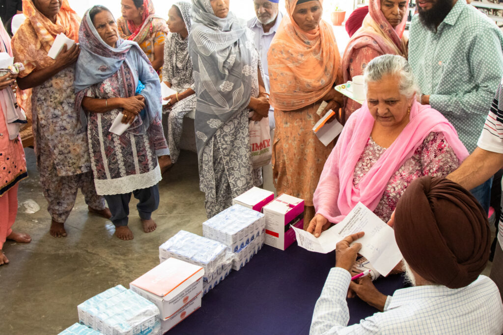 2026-free-medical-camp-bakhshish-international-charitable-society-nussi-jalandhar-02 Distribution of free prescribed eye drops to patients after their eye screening at Gurdwara Bakhshish Dham